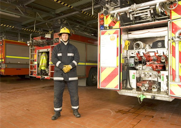 Photo:Portrait of fireman Aaron Tills in the fire station
