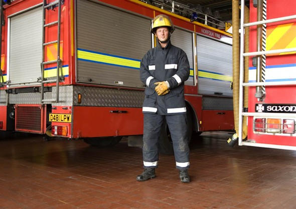 Photo:Portrait of fireman Aaron Tills in the fire station
