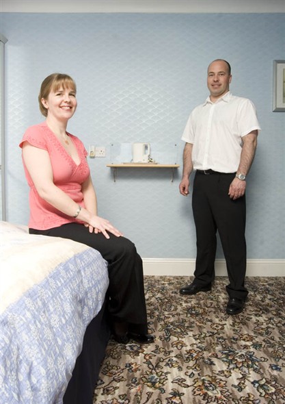 Photo:Portrait of Greg and Samantha Haddon in one of the guesthouse bedrooms