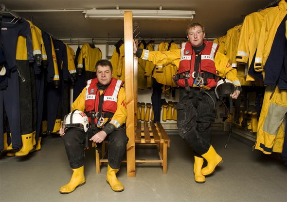 Photo:Portrait of S. Bartram (Coxswain) and P. Lee (station mechanic) in the kit room