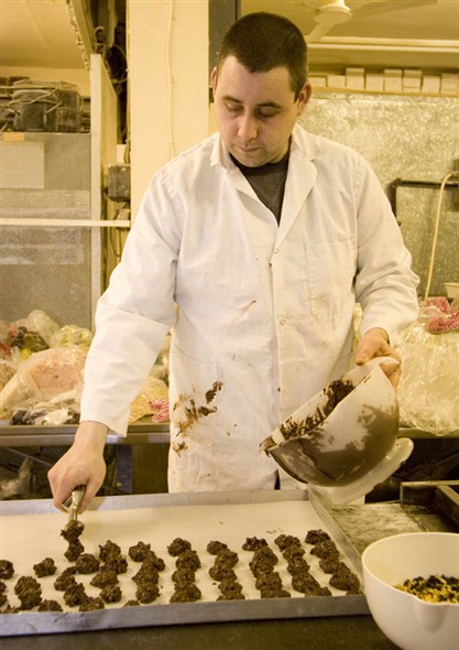 Photo:Portrait of T. Carpenter making chocolates