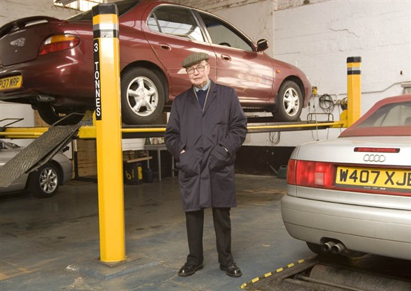 Photo:Portrait of Mr. P. Trett, owner and manager of Tretts garage in the MOT Testing area