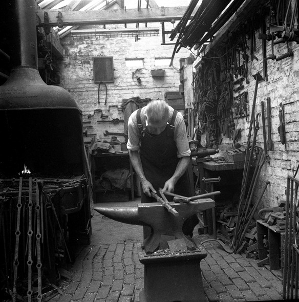 Photo:Photograph of Fred Leak working in his Smithy in 1963