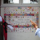 Photo:The Mayor unveiling the tile wall created by the children and staff at Alderman Swindell Primary School.
