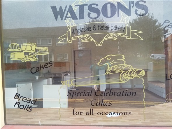 Photo:Close up of etched window of Watson's Bakery
