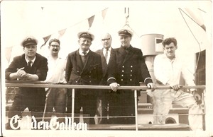 Photo:the crew of golden galleon in the centre is owner john knights on the left willaim gates and on the right is skipper paul barnard